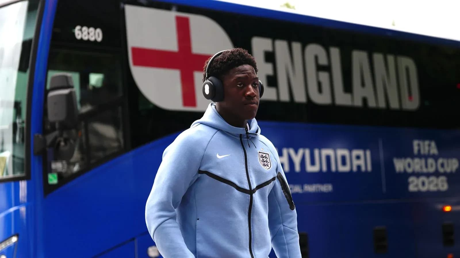 Player walking past England team bus before match Player walking past England team bus before match