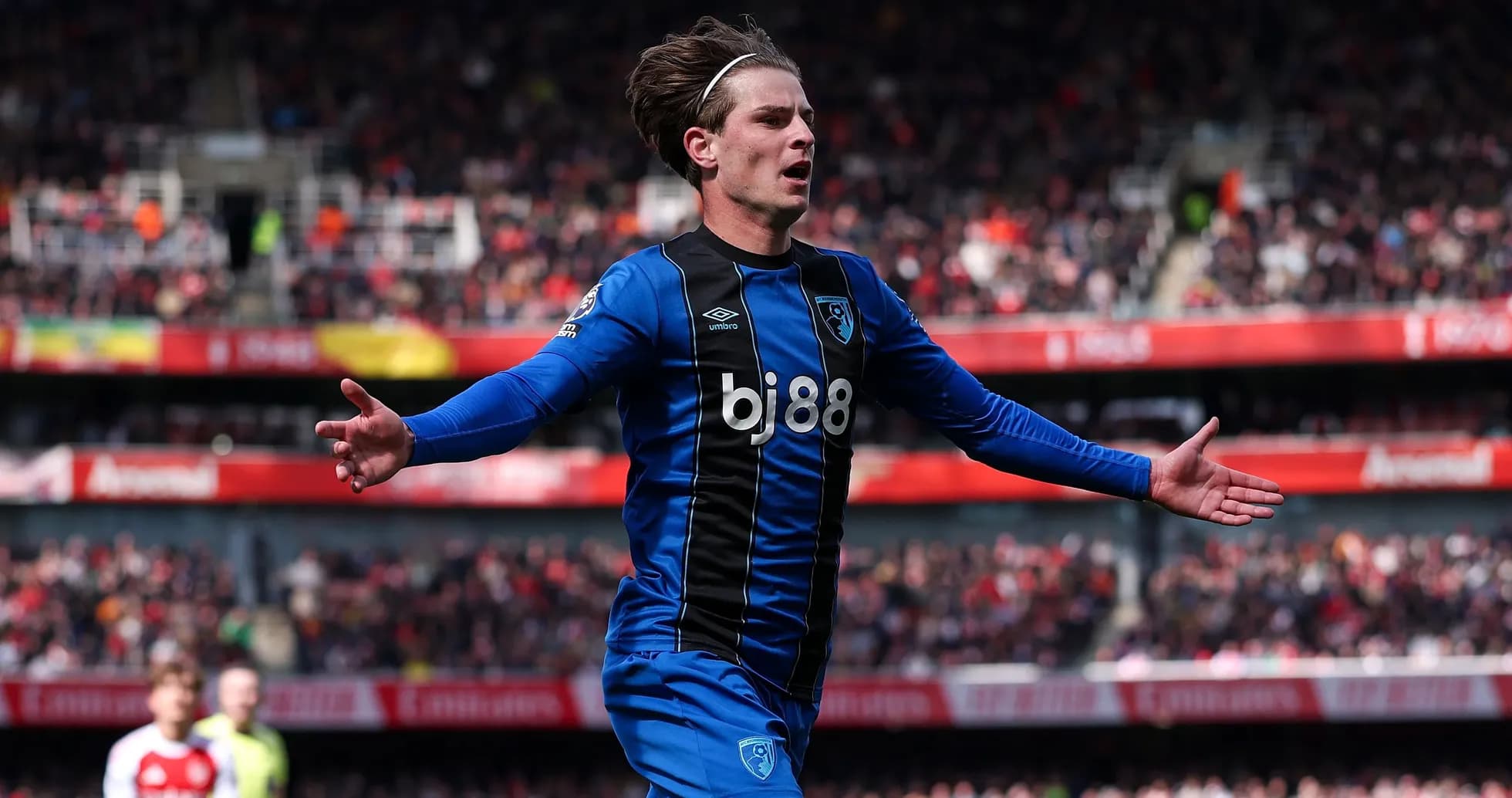 Player celebrating a goal during match at stadium Player celebrating a goal during match at stadium
