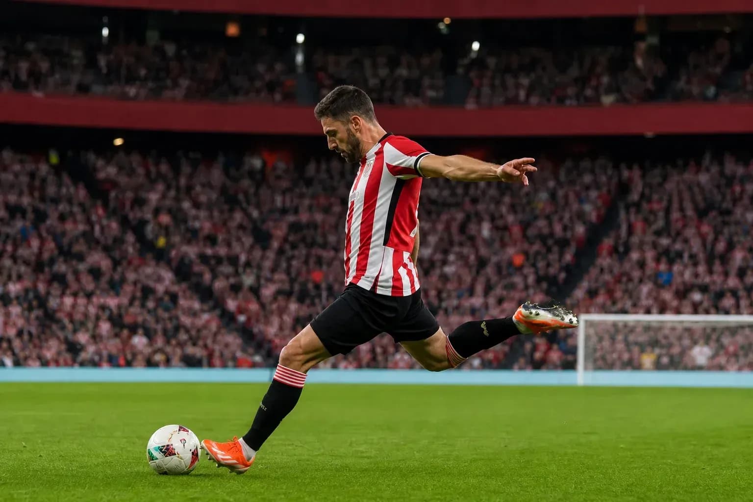 Player taking a free kick during football match Player taking a free kick during football match