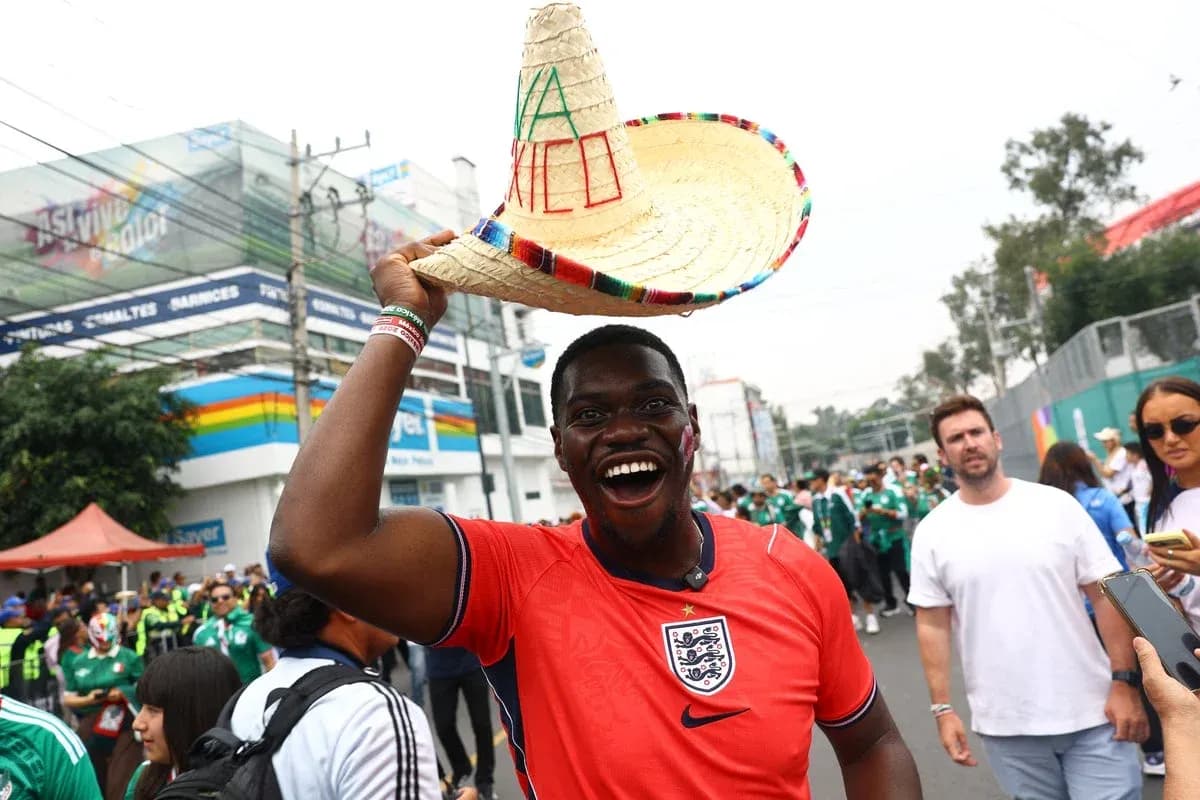 Fan in England jersey wearing sombrero at event Fan in England jersey wearing sombrero at event