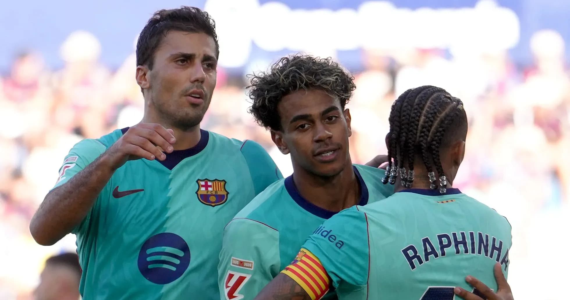 Barcelona players celebrating a goal on the field Barcelona players celebrating a goal on the field
