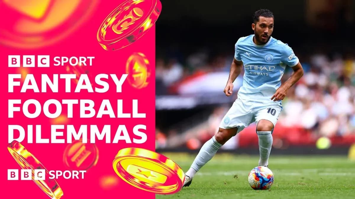 Player in light blue kit running with football Player in light blue kit running with football
