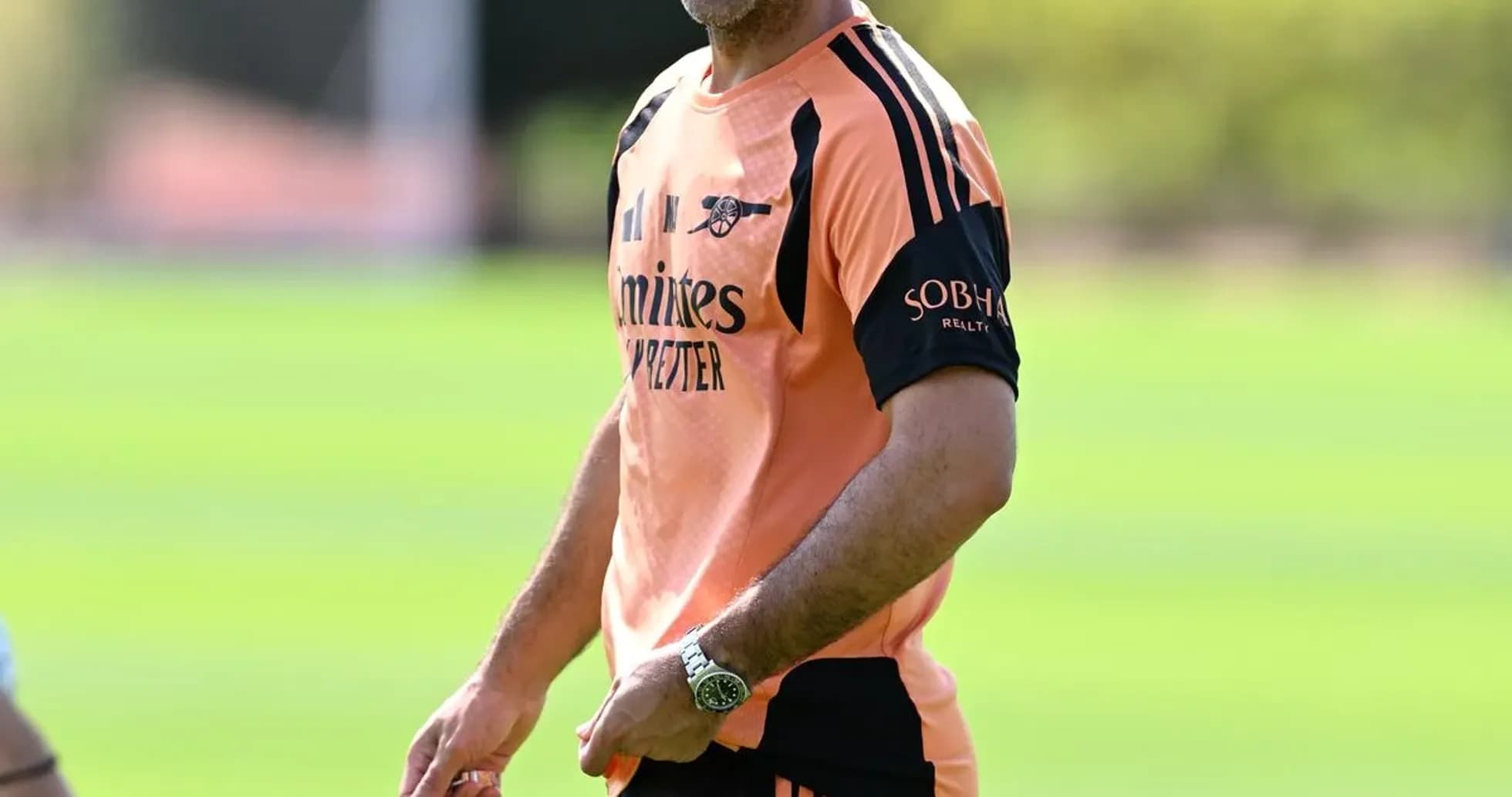 Manager smiling during training session on pitch Manager smiling during training session on pitch