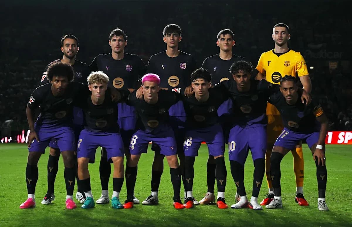 Football team posing for group photo on field Football team posing for group photo on field
