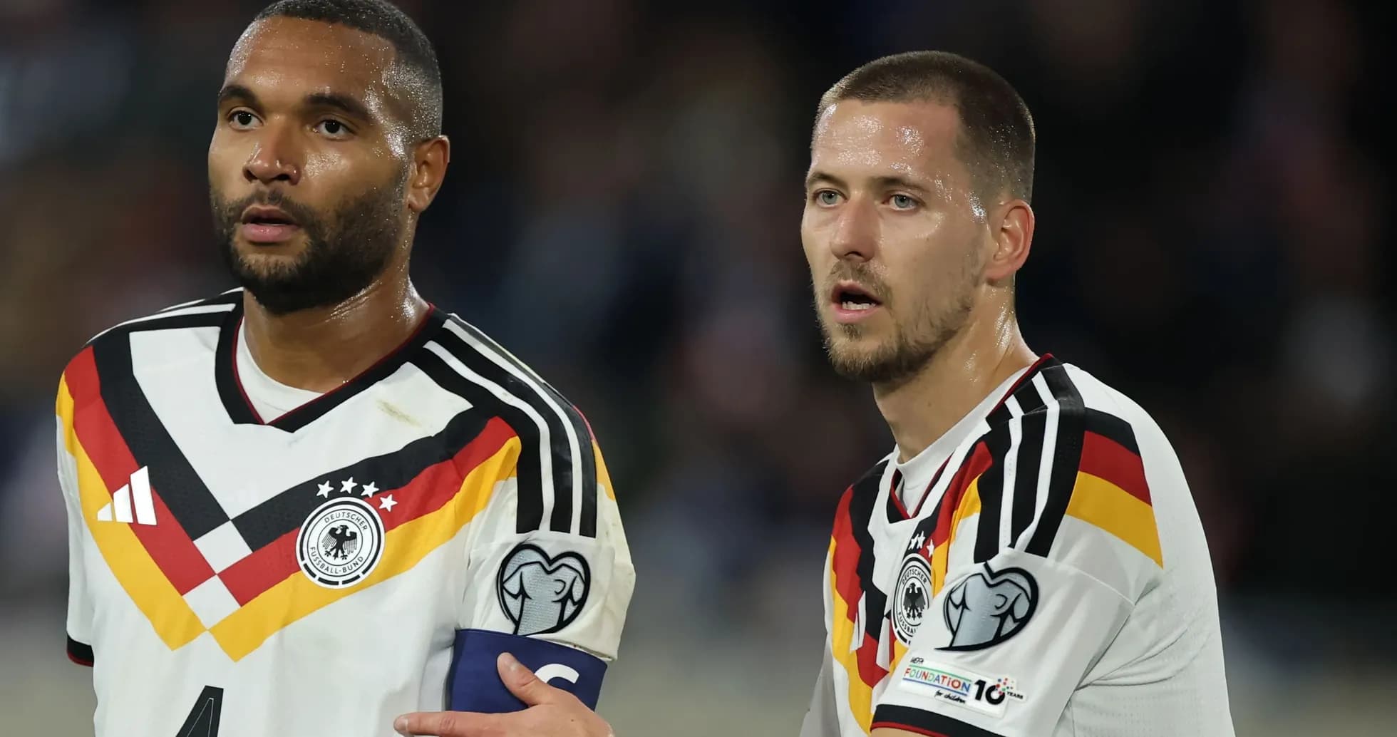Two German players discussing during match Two German players discussing during match