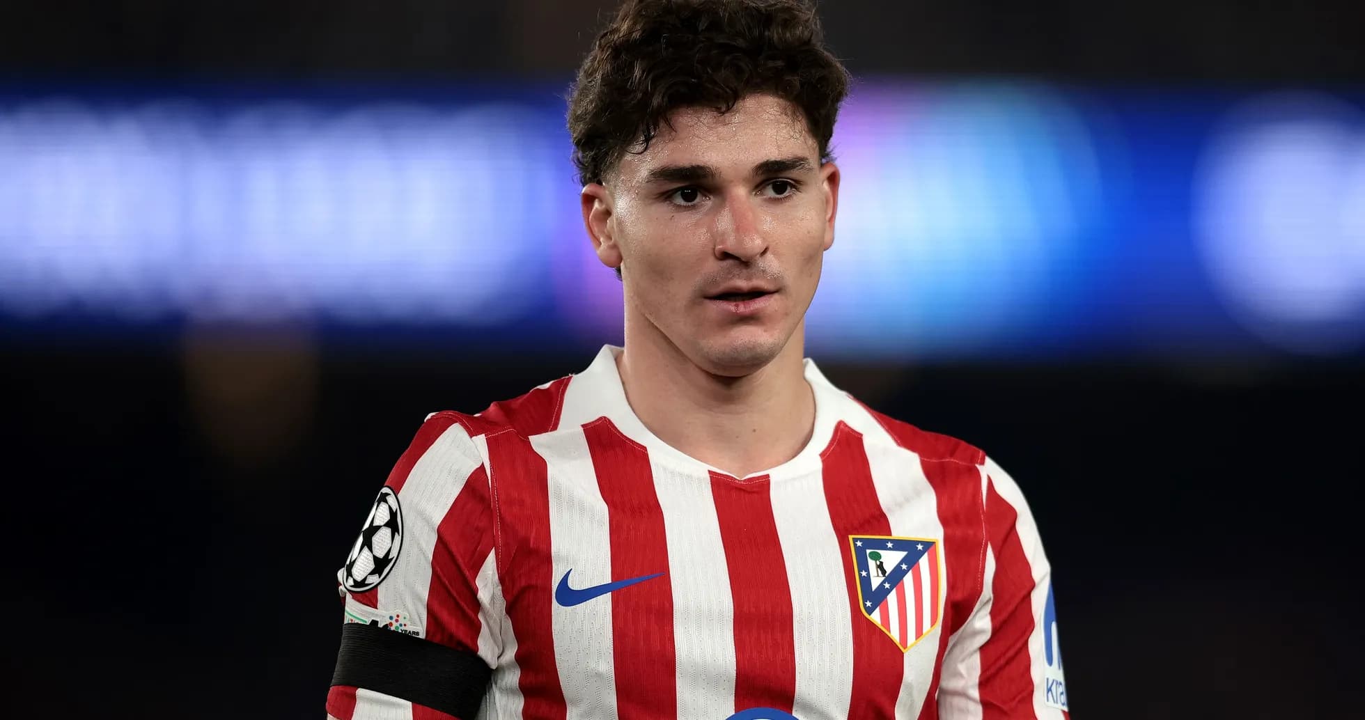 Atletico Madrid player in red and white jersey Atletico Madrid player in red and white jersey