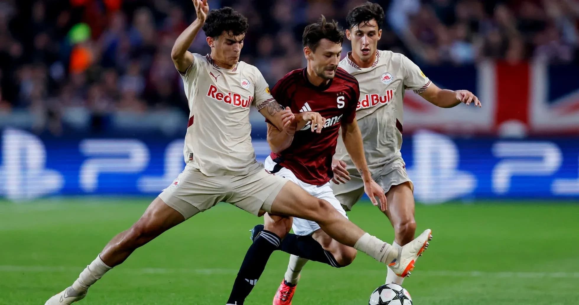 Players competing for the ball in Europa League match Players competing for the ball in Europa League match