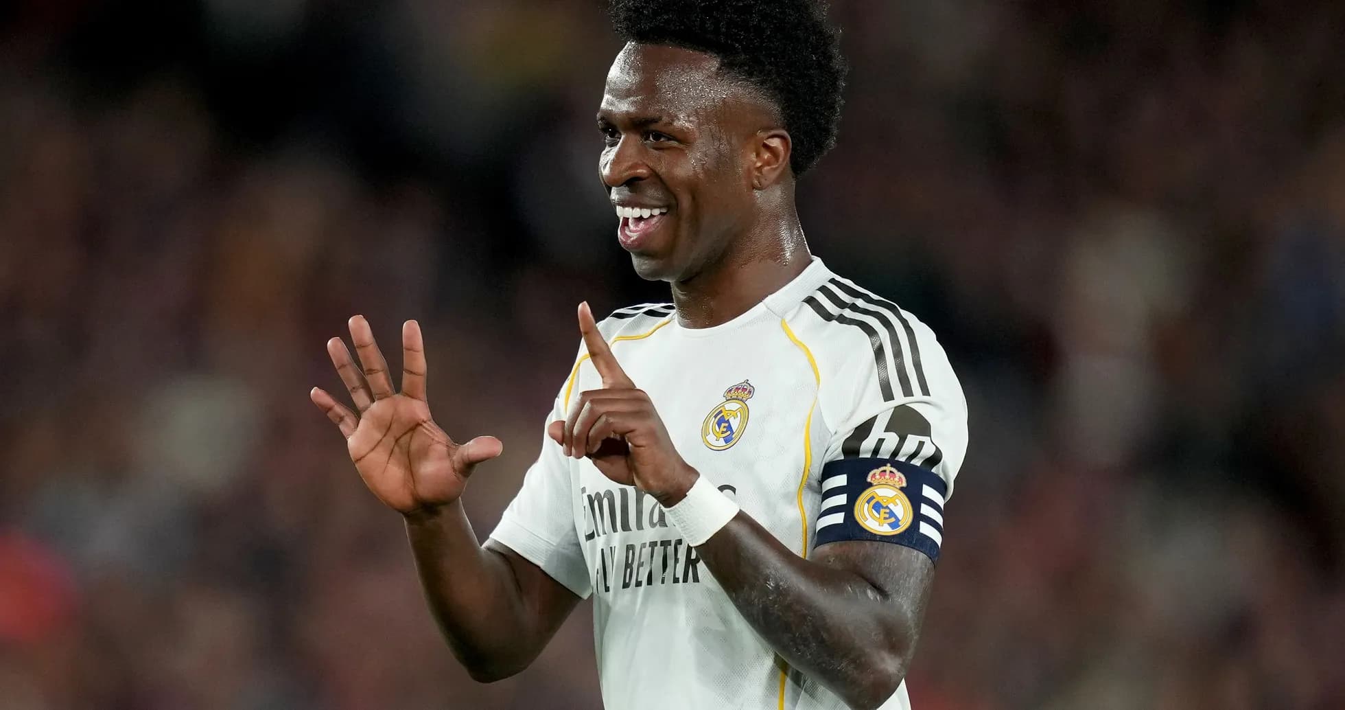 Player celebrating on the field wearing Real Madrid jersey Player celebrating on the field wearing Real Madrid jersey