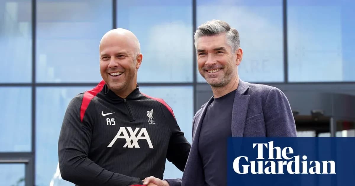 Two coaches shaking hands outside Liverpool training facility Two coaches shaking hands outside Liverpool training facility