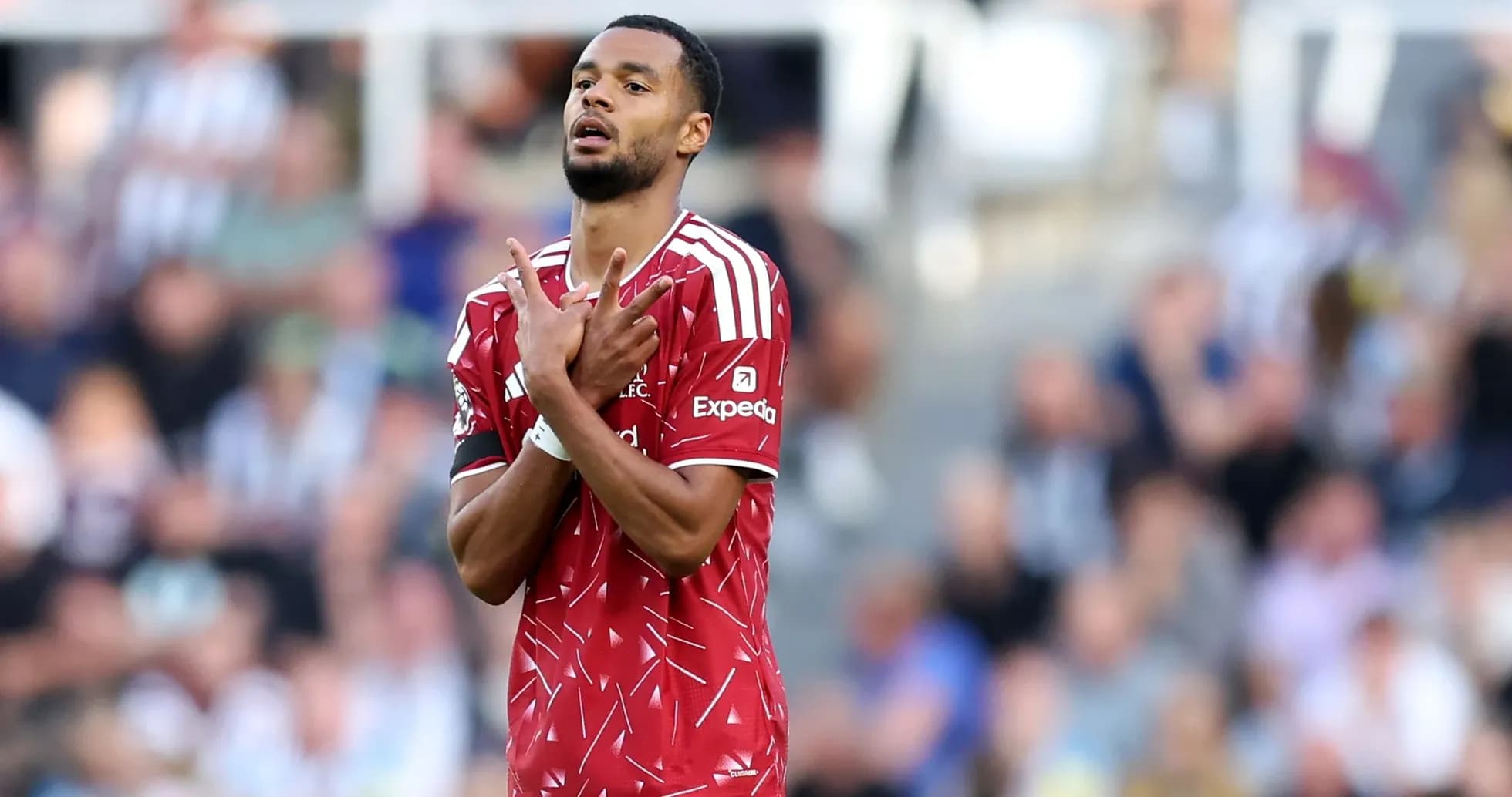 Player gesturing during match, fans in background Player gesturing during match, fans in background