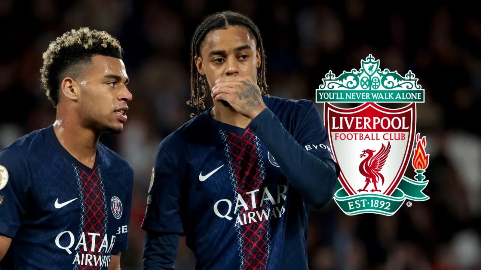 Two players discussing during a match with Liverpool logo Two players discussing during a match with Liverpool logo