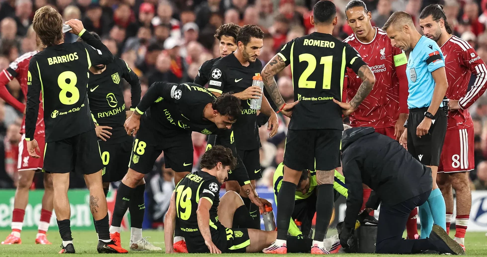 Atletico Madrid players attending to injured teammate Atletico Madrid players attending to injured teammate