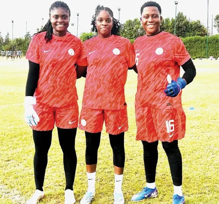 Three female soccer players posing in training kits Three female soccer players posing in training kits