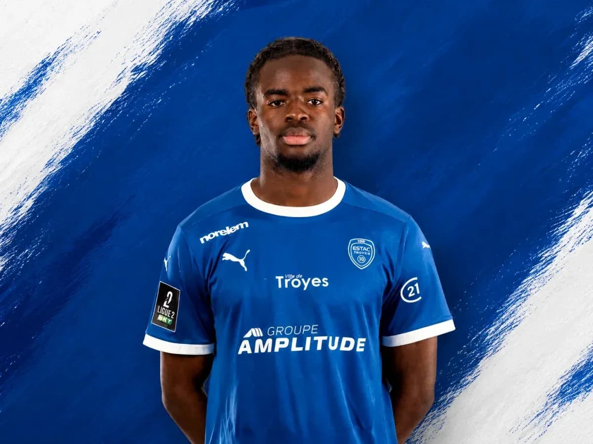 Player in blue ESTAC Troyes jersey against blue background Player in blue ESTAC Troyes jersey against blue background