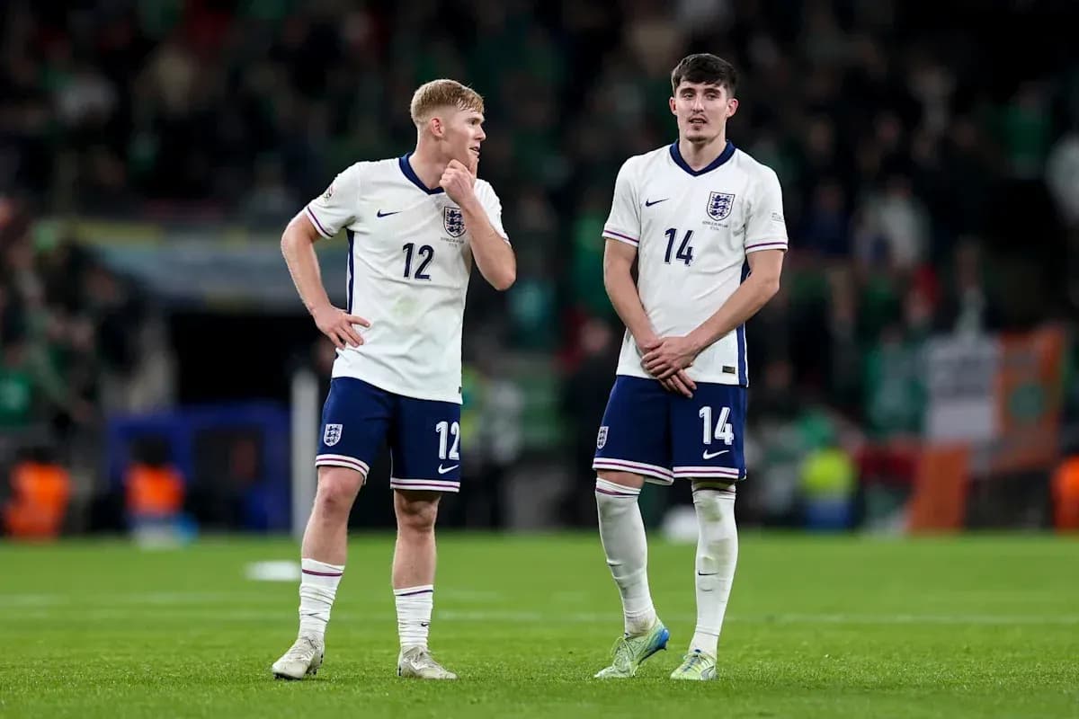 Two England players standing on the pitch after match Two England players standing on the pitch after match