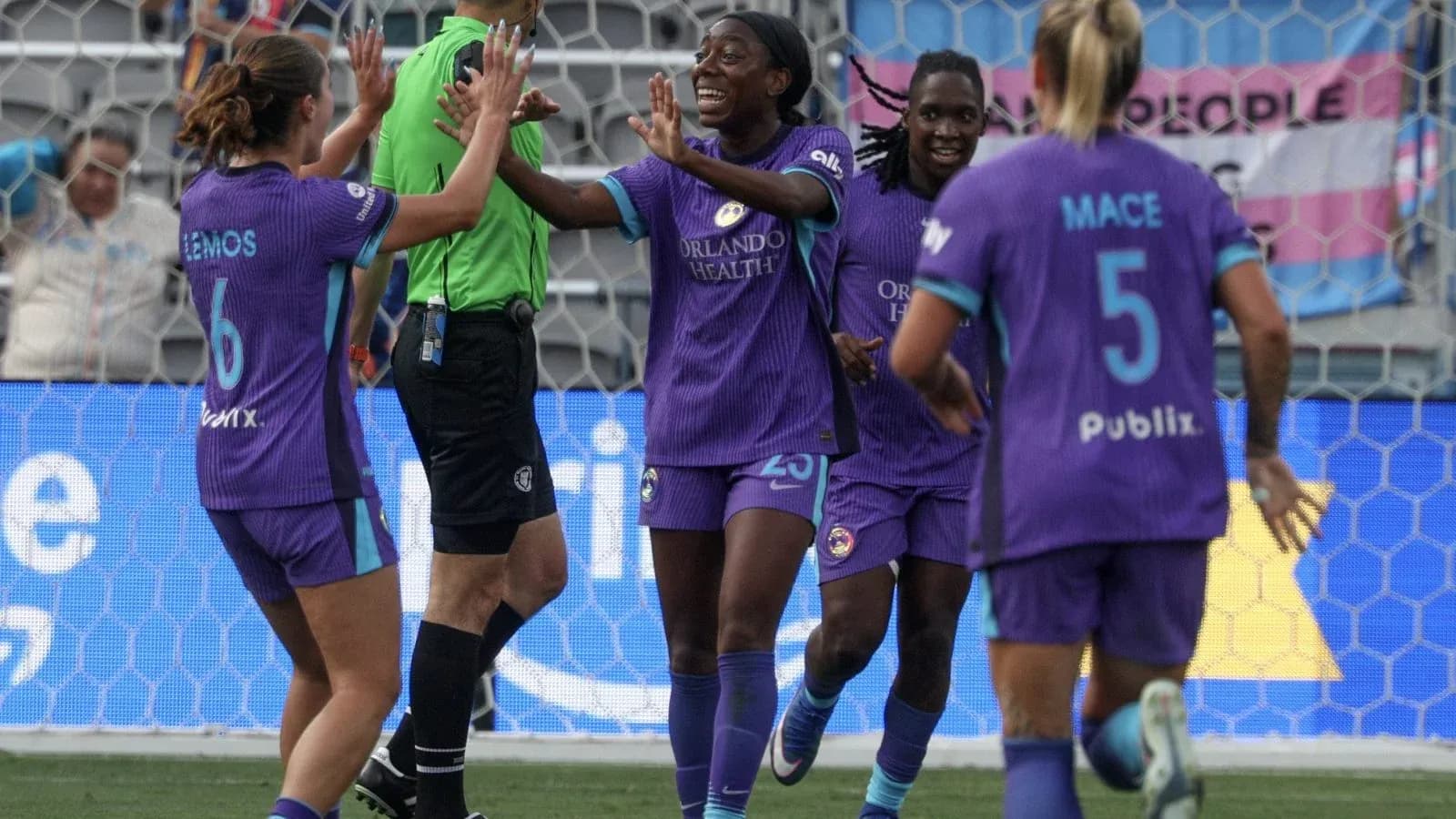 Orlando Pride players celebrating a goal Orlando Pride players celebrating a goal