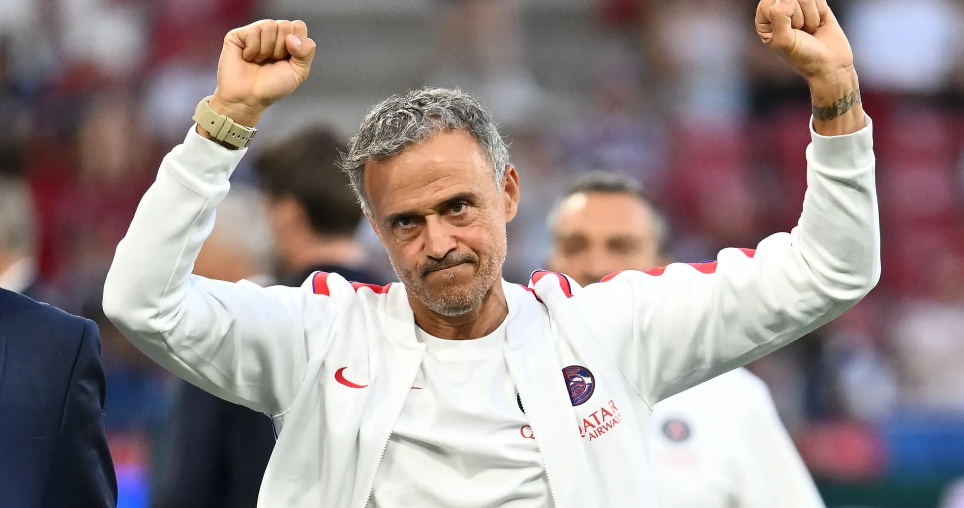 Coach celebrating with raised arms after match Coach celebrating with raised arms after match