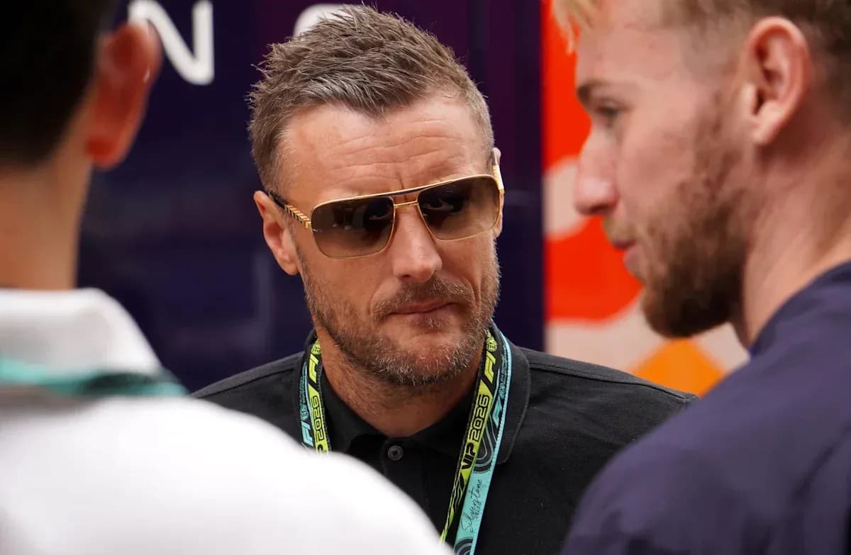 Man in sunglasses talking with two others Man in sunglasses talking with two others