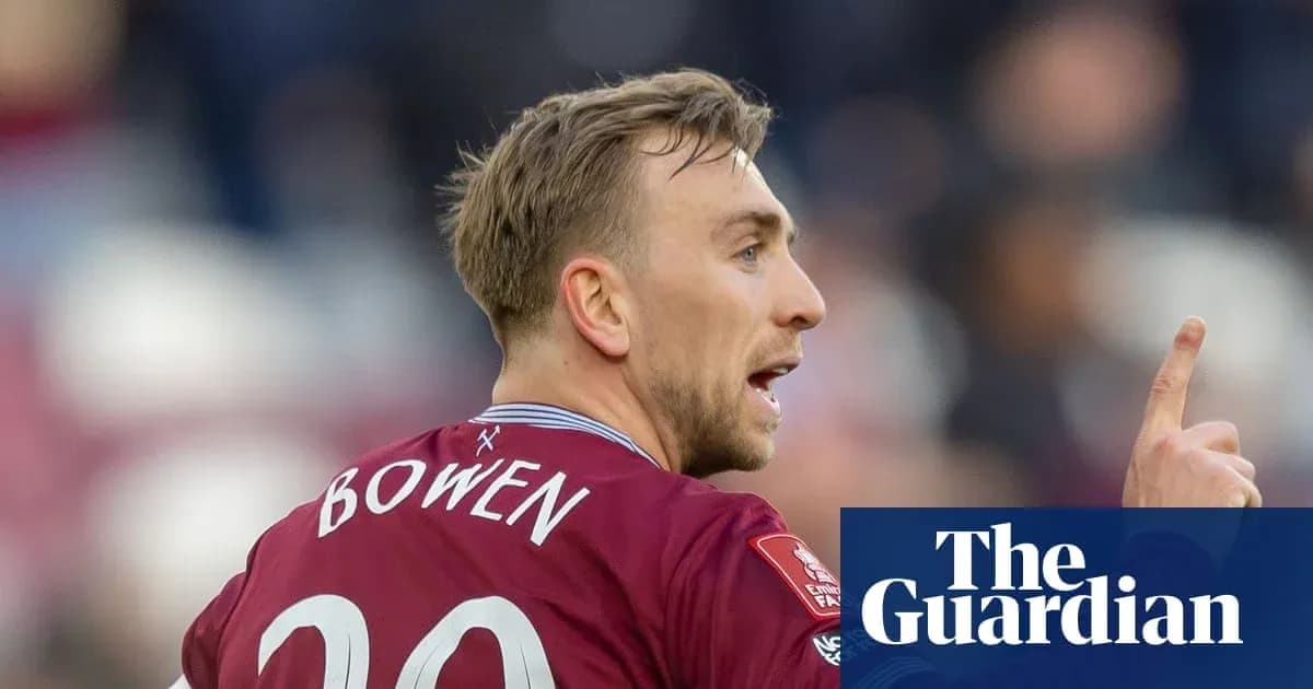 Player in maroon jersey signaling during match Player in maroon jersey signaling during match