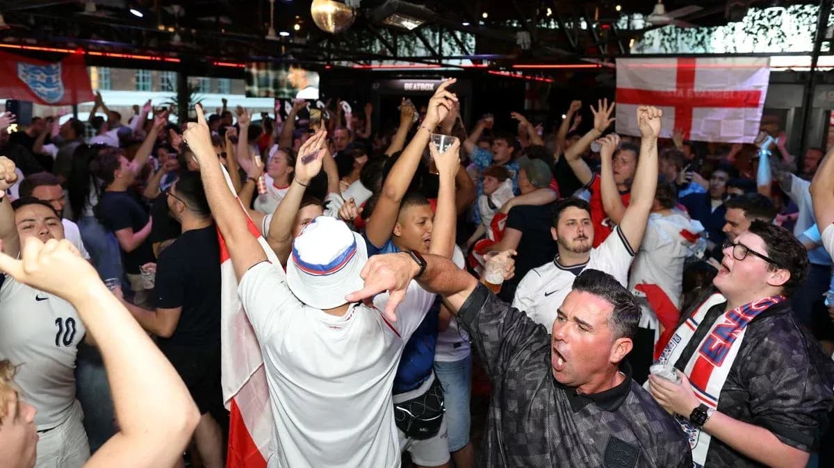 Crowd of fans celebrating at sports bar event Crowd of fans celebrating at sports bar event