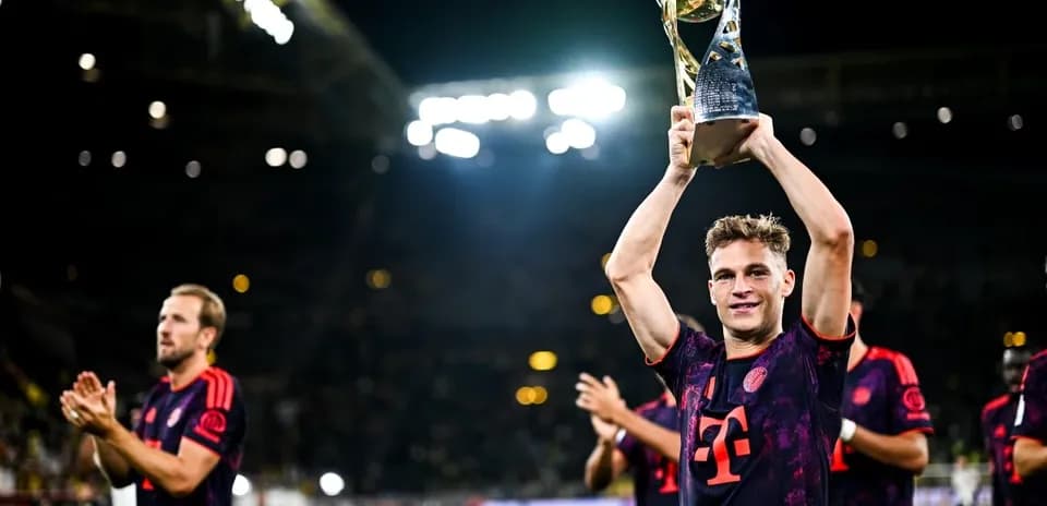 Player celebrating with trophy after match victory Player celebrating with trophy after match victory