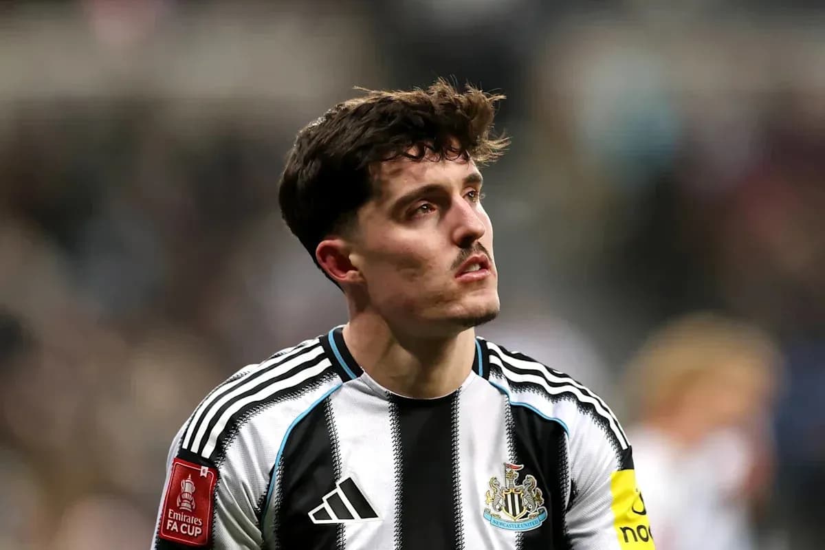 Newcastle player with captain's armband on pitch Newcastle player with captain's armband on pitch