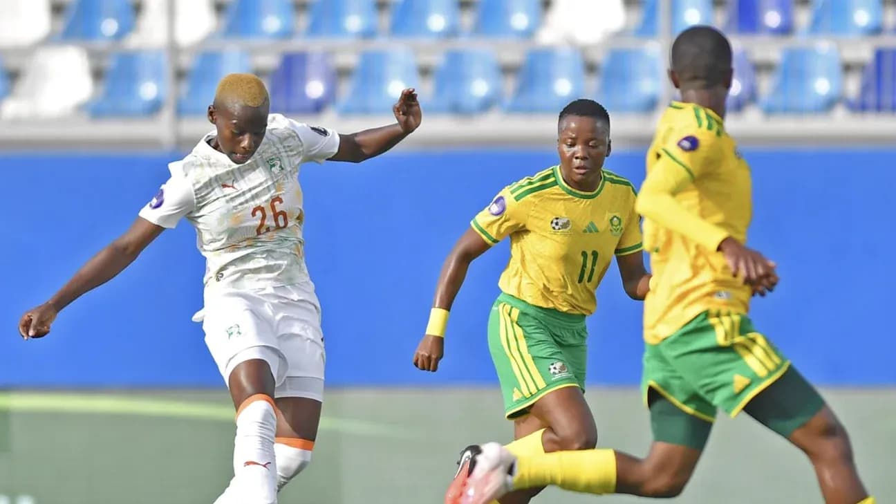 Ivorian player kicking the ball during match action Ivorian player kicking the ball during match action