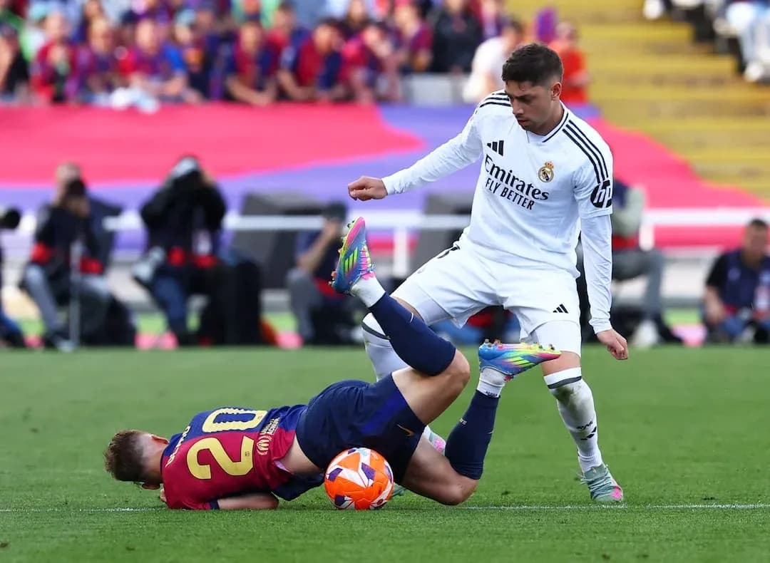 Player tackling opponent during Barcelona vs Real Madrid Player tackling opponent during Barcelona vs Real Madrid