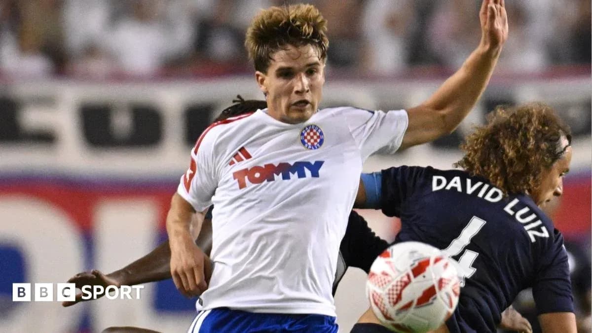 Player challenged by opponent during a football match Player challenged by opponent during a football match