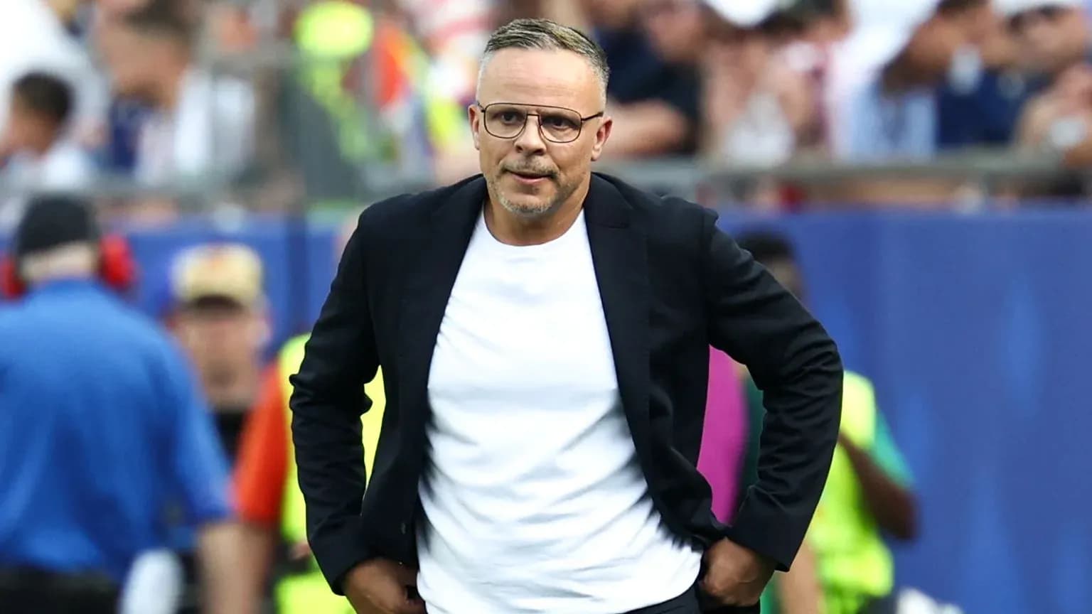 Coach walking along the sideline during match Coach walking along the sideline during match