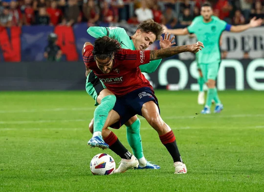 Players contesting for the ball during match Players contesting for the ball during match