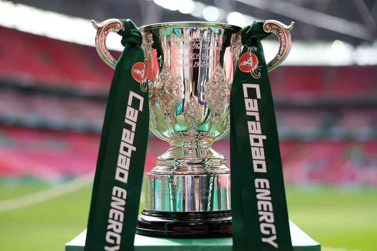 Carabao Cup trophy displayed on green pedestal Carabao Cup trophy displayed on green pedestal