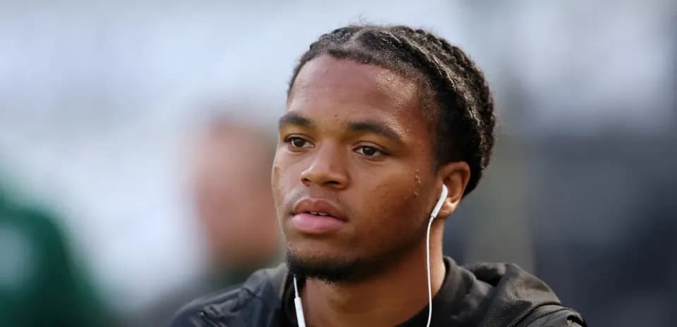 Player with earbuds preparing before the match Player with earbuds preparing before the match