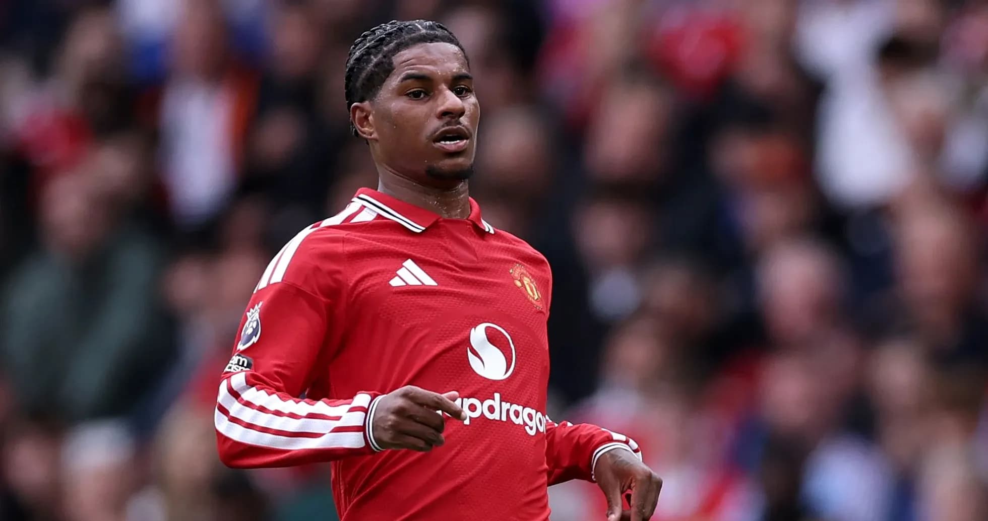 Player in red Manchester United kit during match Player in red Manchester United kit during match