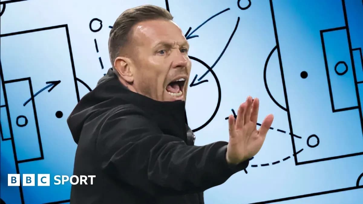 Coach instructing players with tactical board behind Coach instructing players with tactical board behind