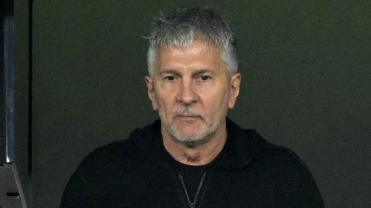 Man with gray hair in dark jacket looking ahead Man with gray hair in dark jacket looking ahead