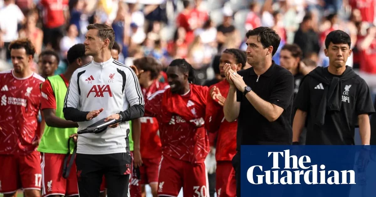 Liverpool players and staff applauding fans after match Liverpool players and staff applauding fans after match