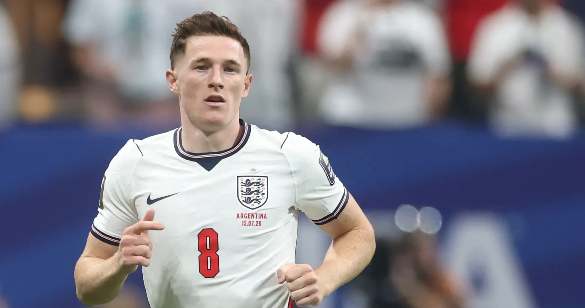 Player in England kit running on the pitch Player in England kit running on the pitch