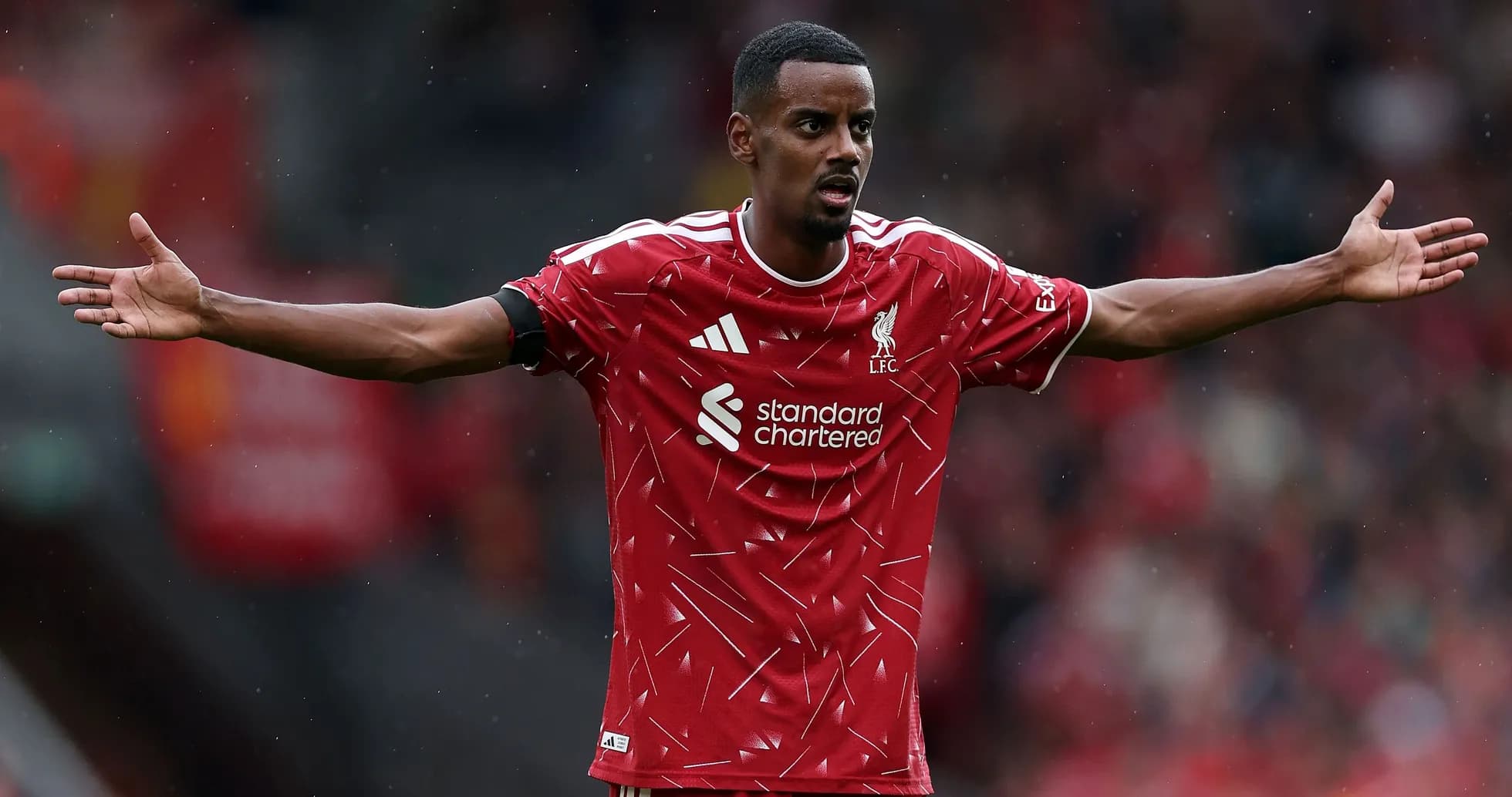 Player gesturing during Liverpool match at Anfield Player gesturing during Liverpool match at Anfield