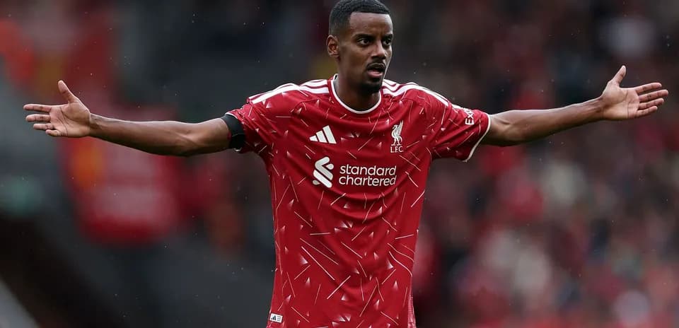 Player gesturing during Liverpool match at Anfield Player gesturing during Liverpool match at Anfield