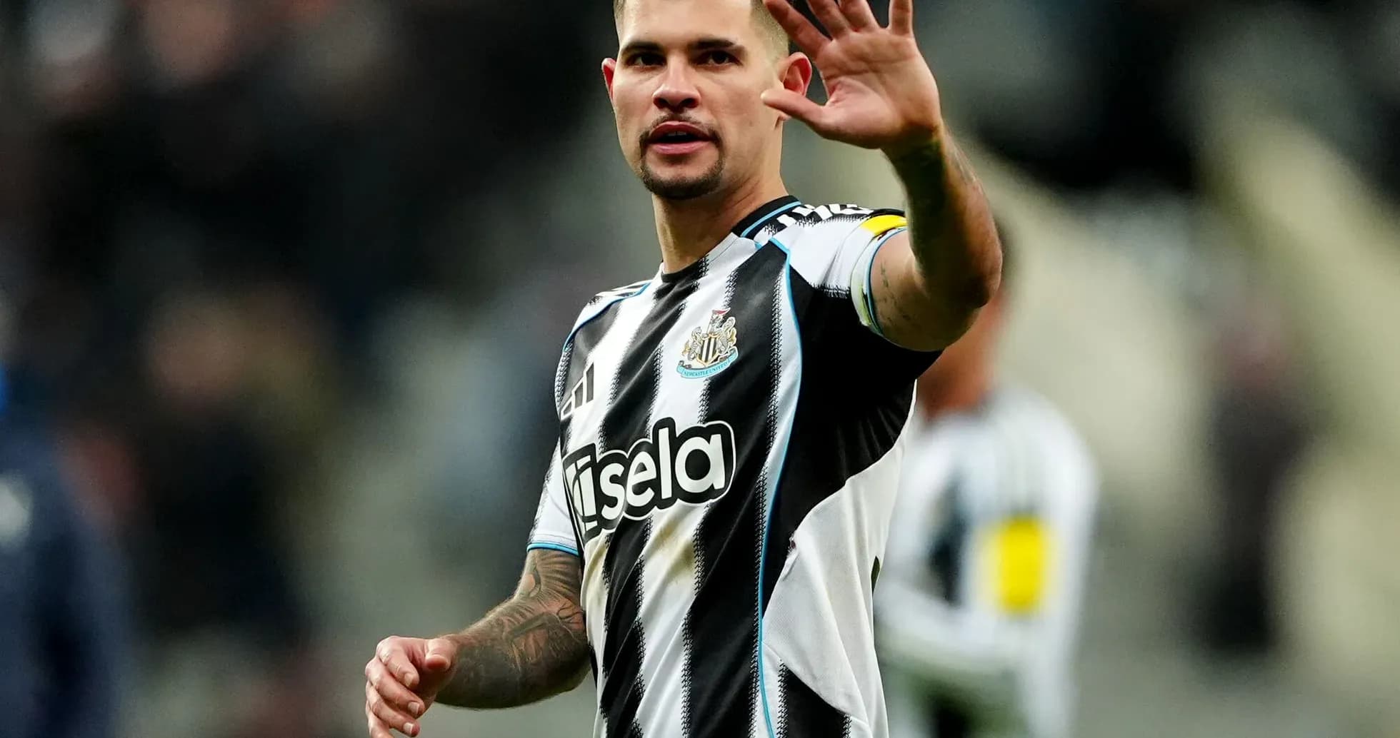 Newcastle player waving to fans during match Newcastle player waving to fans during match