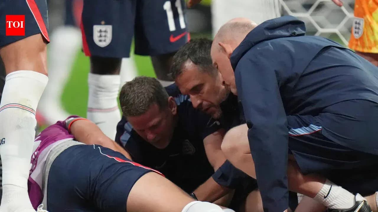 Medical staff attending to injured player on field Medical staff attending to injured player on field