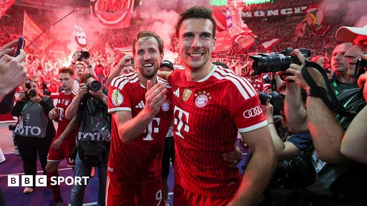 Two Bayern Munich players celebrating with fans Two Bayern Munich players celebrating with fans