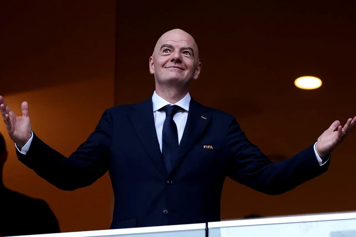 FIFA president gesturing from a balcony FIFA president gesturing from a balcony