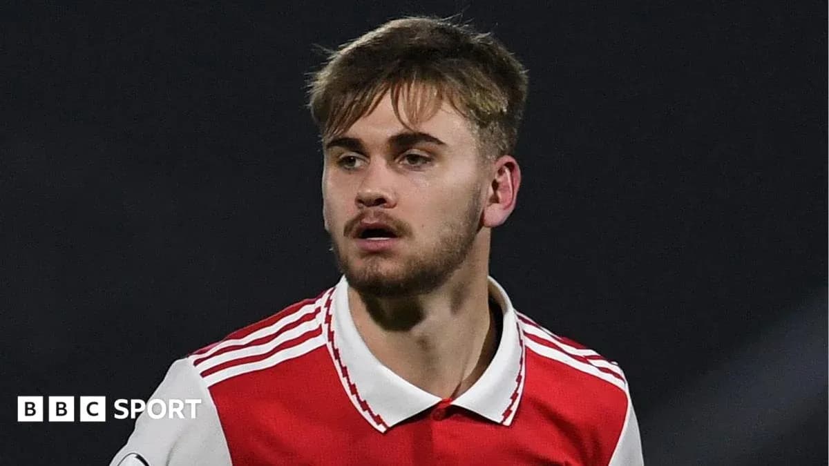 Player wearing Arsenal jersey during a match Player wearing Arsenal jersey during a match
