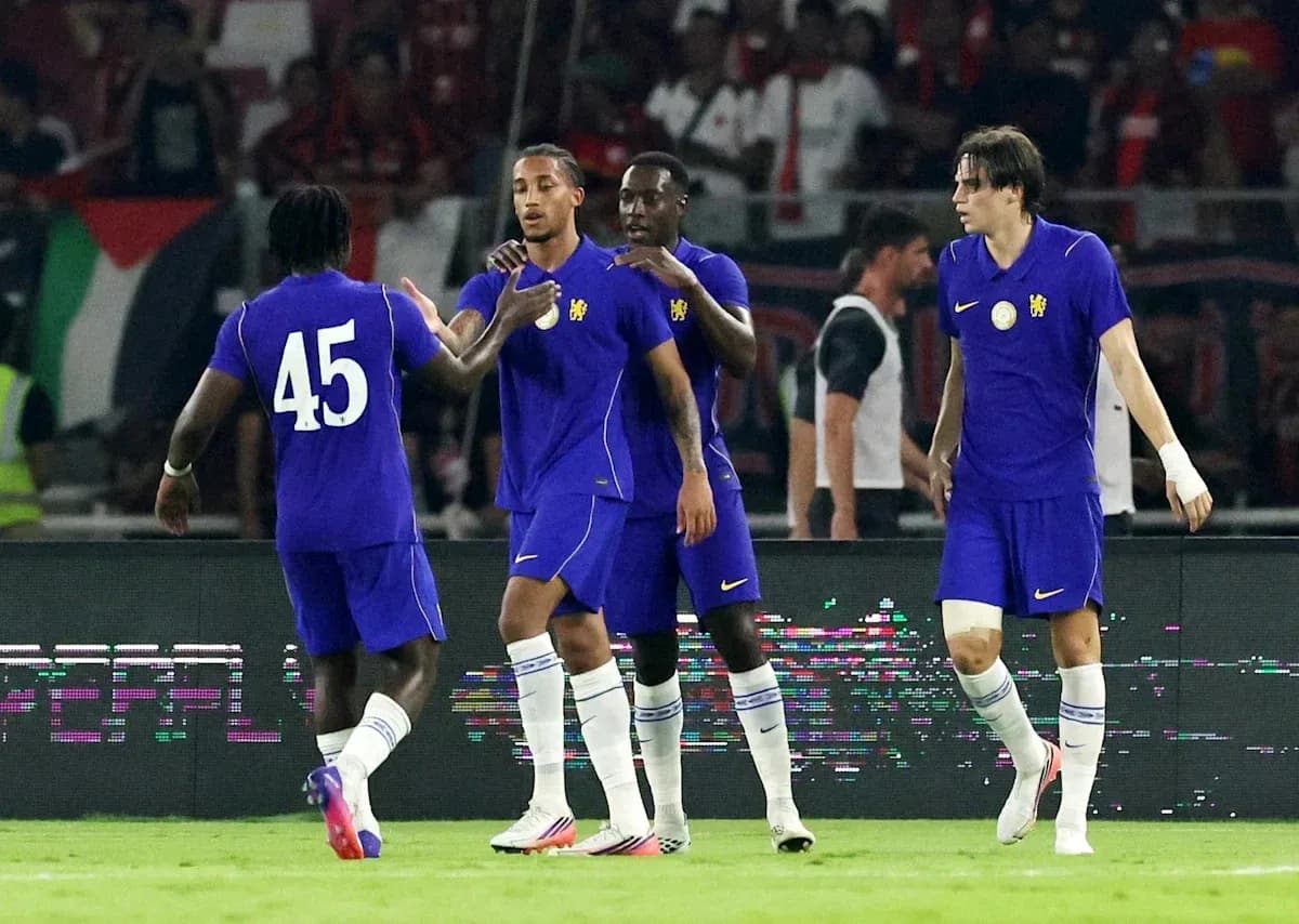 Players celebrating a goal during a football match Players celebrating a goal during a football match