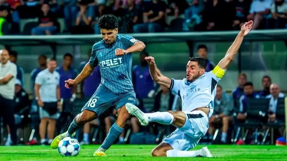 Player tackling during Slovan Bratislava match Player tackling during Slovan Bratislava match