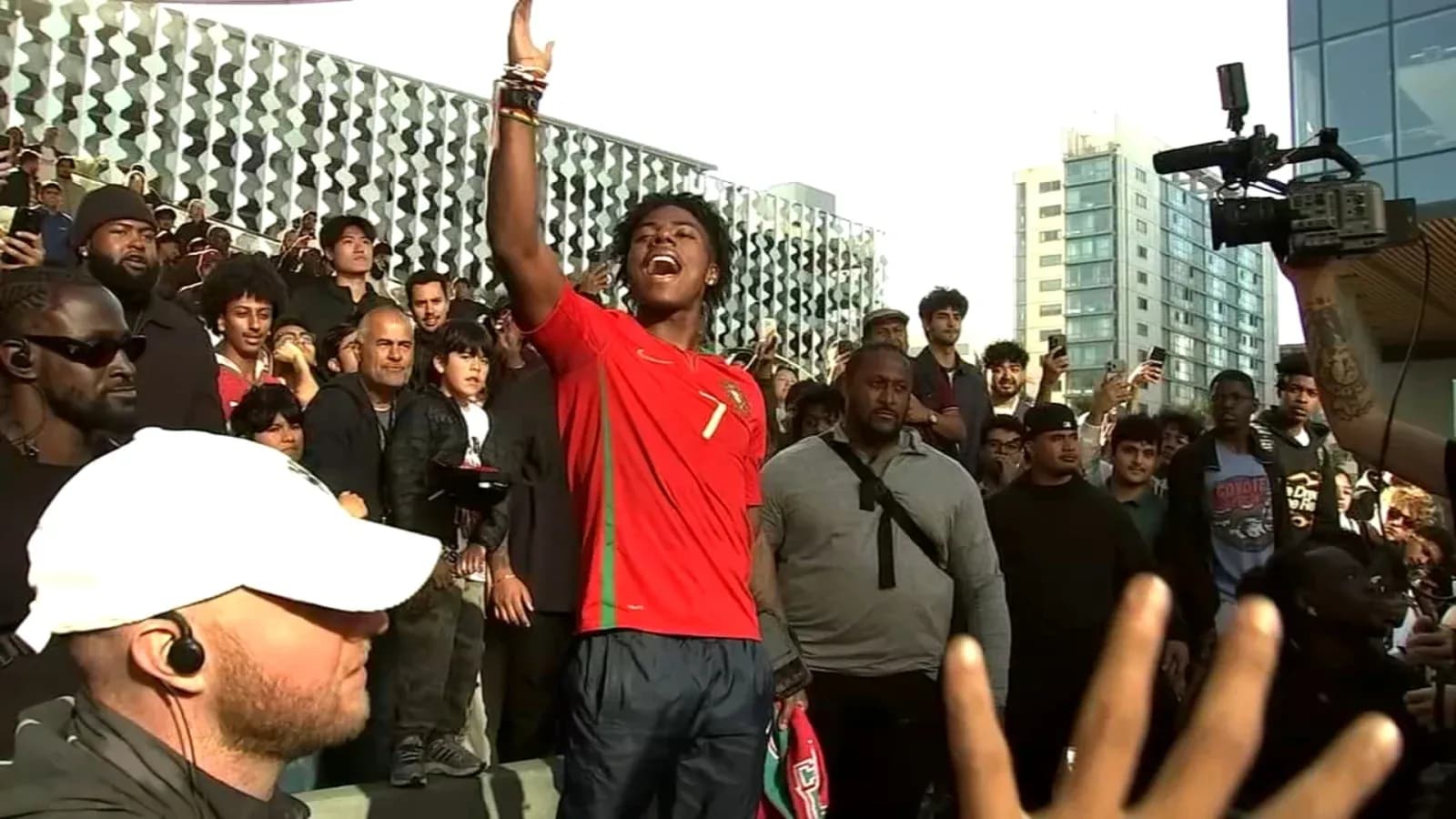 Fan in Portugal jersey celebrating with crowd Fan in Portugal jersey celebrating with crowd