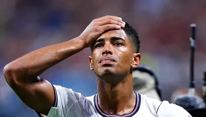 Player holding forehead during match Player holding forehead during match