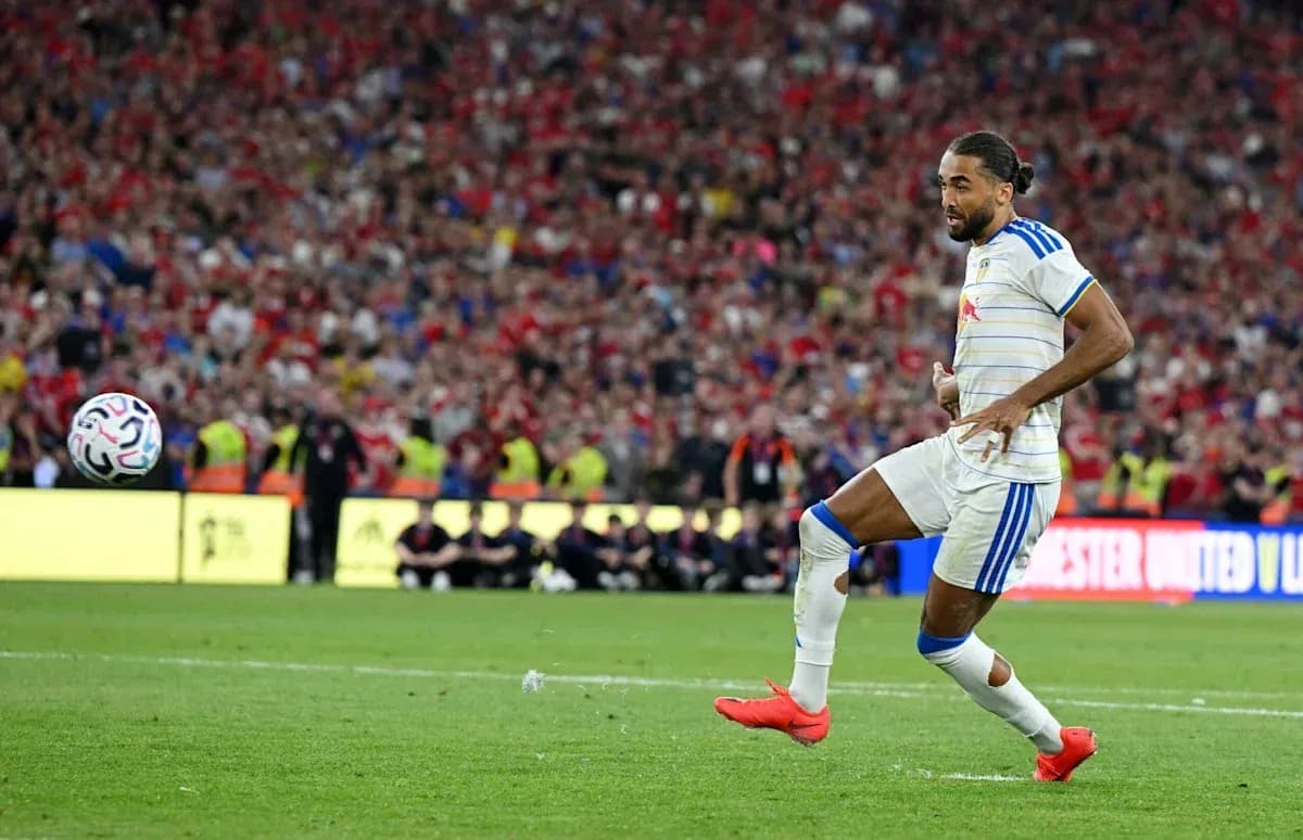 Player kicking ball during football match Player kicking ball during football match